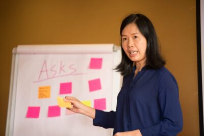 Asian woman leading workshop