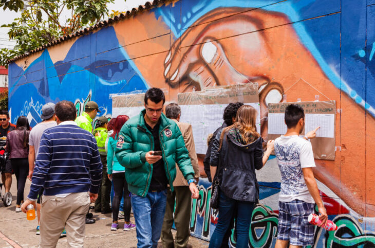 Colombia - voters check lists posted on the wall