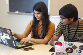 Young woman and man at hackday-style event